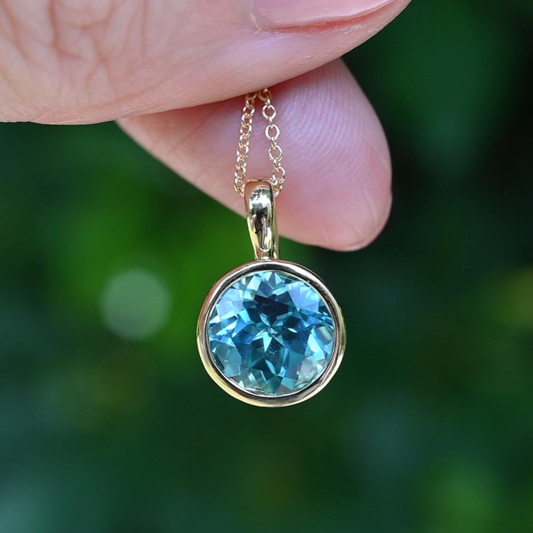 10k Yellow Gold lab Aqua blue sapphire brilliant cut Charm Necklace: Elegant Bezel-Set Pendant