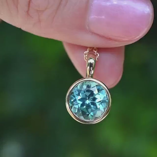 10k Yellow Gold lab Aqua blue sapphire brilliant cut Charm Necklace: Elegant Bezel-Set Pendant