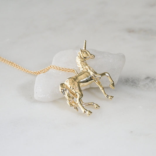 The last unicorn pendant necklace in 18k gold plate with gold fill chain.